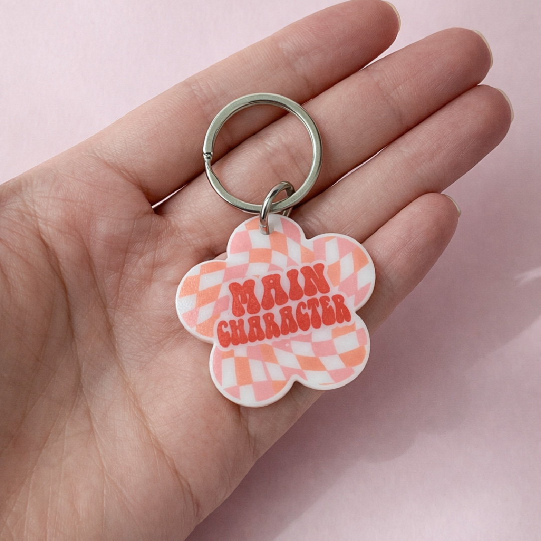 Main Character QR pet ID tag held in hand — Hola Lulu Pets